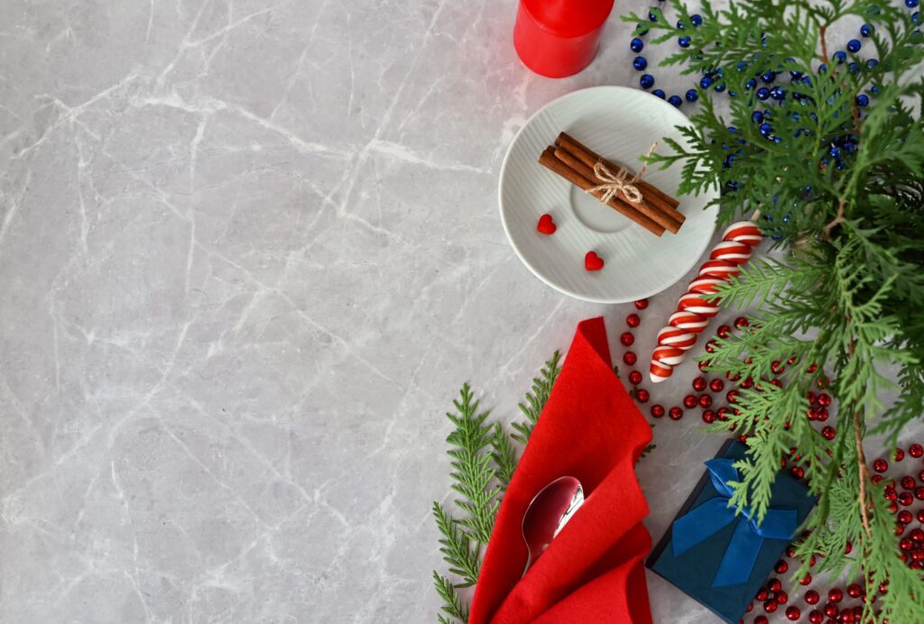 Merry Christmas, Happy New Year Theme. Composition From Branches Of A Natural Christmas Tree And Red Ball. Decoration On A Background Of Light Wooden Boards