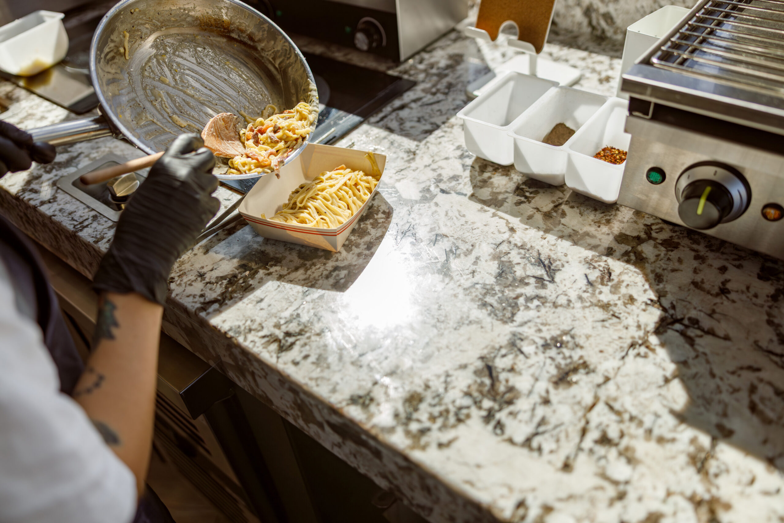 talented chef skillfully preparing a delicious meal on a beautiful granite countertop