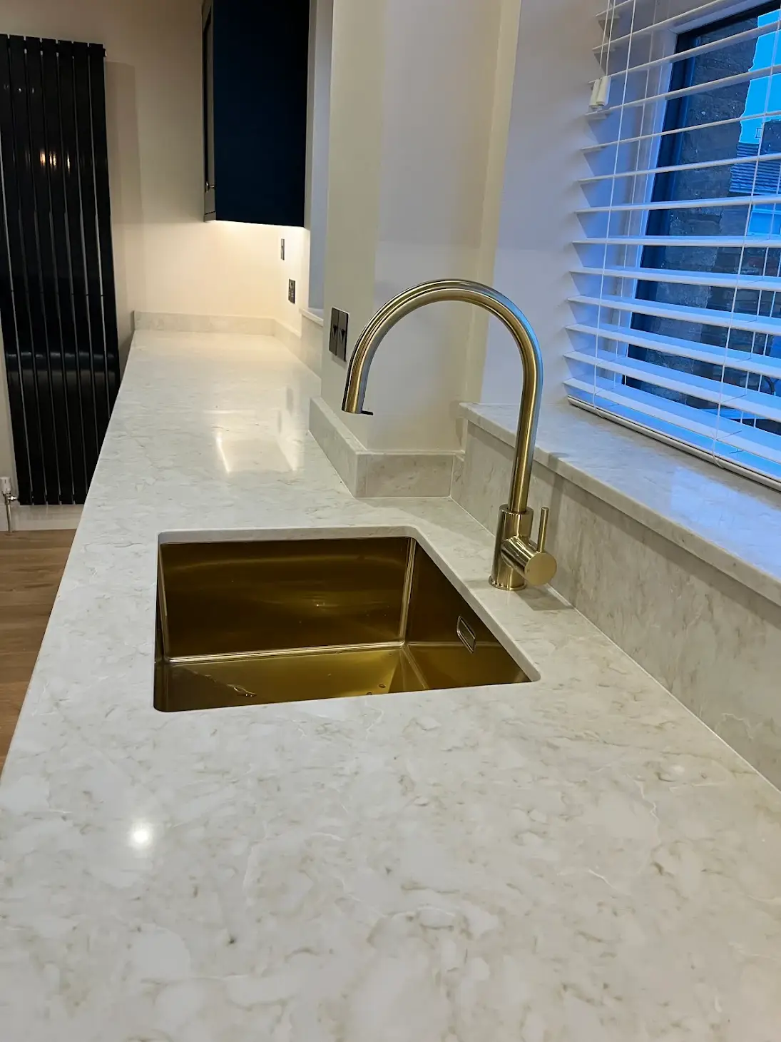 Modern Kitchen With Gold Sink.